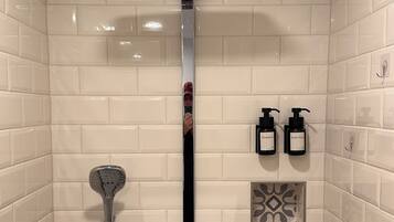 Shower, hair dryer, towels, toilet paper