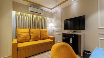 Superior Studio, City View | Living area | Smart TV