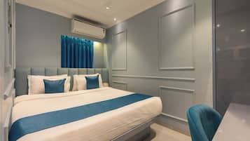 Premium bedding, memory-foam beds, desk, laptop workspace