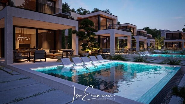 Ein modernes Haus mit Pool, Sitzgelegenheiten im Freien und einem Restaurant.