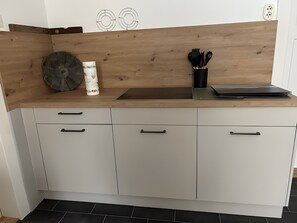 Fridge, electric kettle, cookware/dishes/utensils, spices