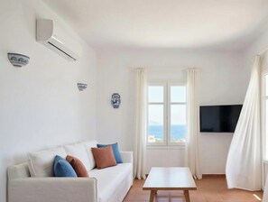 Departamento, vista al mar | Área de sala de estar