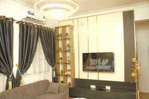 Deluxe Apartment, Balcony, City View | Living area - Monica Apartment (Abuja)