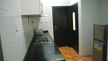 Deluxe Apartment, Balcony, City View | Private kitchen | Fridge, microwave, oven, stovetop
