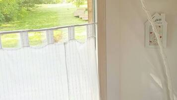 House, 1 Bedroom, Balcony, Garden View | Living area | Books