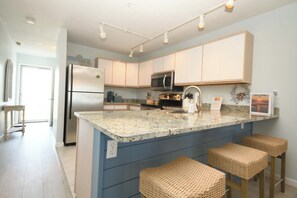 Fridge, microwave, oven, stovetop - Cozy, comfortable 2 bedroom bayside condo with WiFi, an outdoor pool, and a breathtaking view of the bay located midtown and just a few blocks from the beach! (Ocean City)