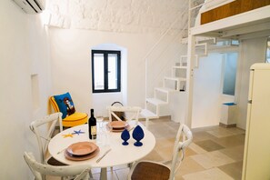 Panoramic House, Sea View | Living area | Flat-screen TV - Casetta Bouganville - Arcuève (Ostuni)
