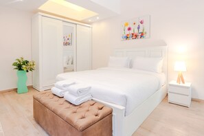 A neatly arranged bedroom with a bed, a bedside table with a lamp, a wardrobe, and a decorative plant. - Vesta - Luxury APT - 2BR - Sheikh Zayed I (Sheikh Zayed City)