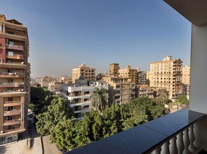 A cityscape with multi-story buildings, some with balconies and satellite dishes. - Vesta - Luxury Duplex APT - 4BR - Nasr City (Cairo)