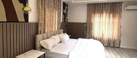 Economy Apartment, Balcony, City View | Desk, laptop workspace, blackout drapes, soundproofing