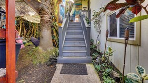 A staircase leading to a house with a 'WELCOME' mat at the bottom. - Lush Outdoor Space & Epic Views! Kailua-kona Home (Kailua-Kona)