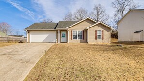 A single-story house with a garage, a front yard, and a small detached garage. - Family Home in Fountain Inn, 2 Mi to Main St! (Fountain Inn)