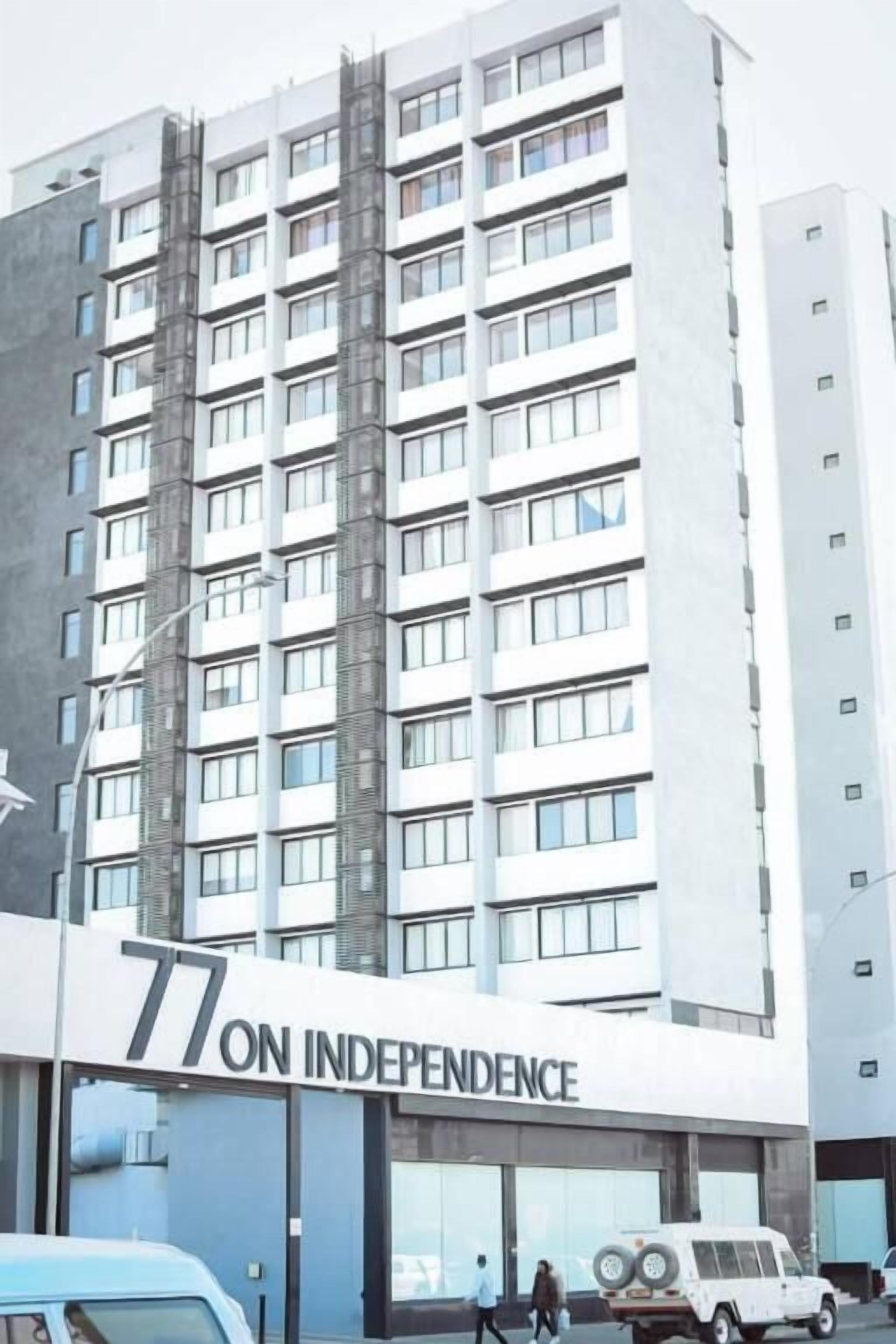A modern building with a sign reading "77 ON INDEPENDENCE."