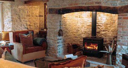 A mid-18th-century Grade II listed Purbeck stone Cottage near Corfe Castle.