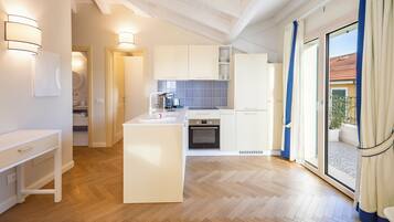 Panoramic Penthouse, Balcony, Sea View (Oltremare) | Private kitchen | Full-sized fridge, stovetop, high chair, cookware/dishes/utensils