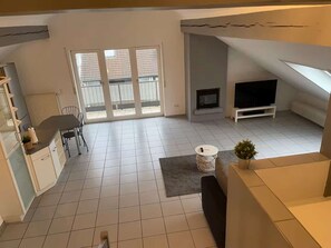 Living room - Loft with Fireplace – a Charming and Unique Apartment (Karlsdorf-Neuthard)