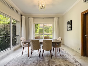 Dining - Spacious 3-Bedroom Garden Apartment in Katameya Plaza, New Cairo (Cairo Governorate)