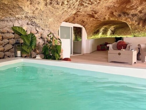 Cave with heated indoor pool and garden