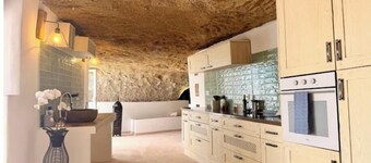 Cave with heated indoor pool and garden