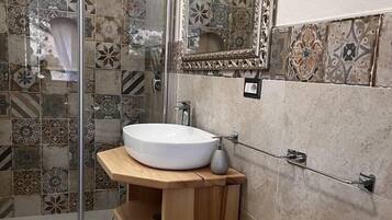 Shower, hair dryer, slippers, towels