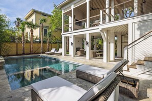 A modern house with a swimming pool, outdoor seating, and a covered patio area. - New Ocean View Home: Pool & Putting Green (Isle Of Palms)