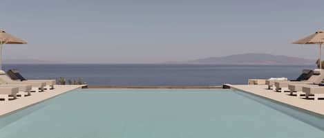 Seasonal outdoor pool, pool umbrellas, sun loungers