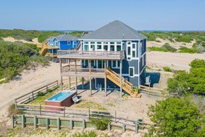 A beachfront property with a main house, a secondary house, and a swimming pool. - Gorgeous semi-oceanfront home on the 4x4 beaches w/ swim spa & ocean views! (Carova)