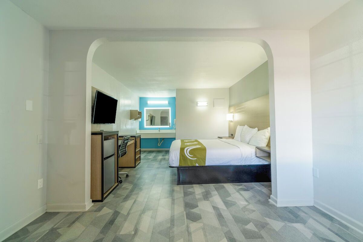 Settle into a spacious room with desk, TV, and mini-fridge.