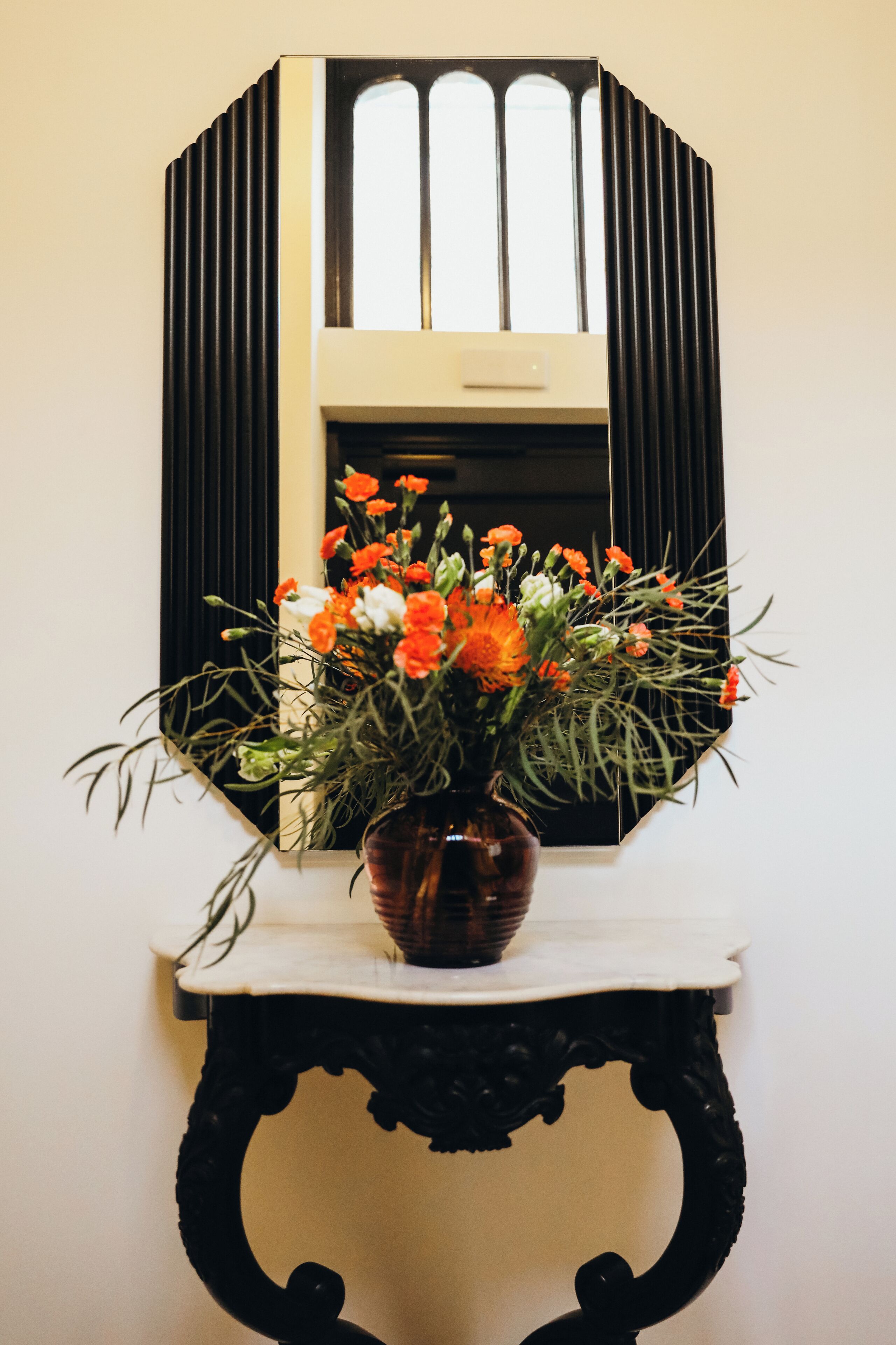 A vase with flowers on a table.