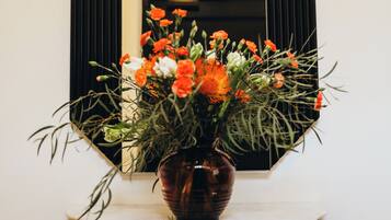 A vase with flowers on a table.