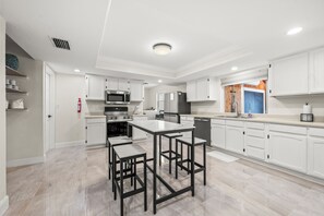 Fridge, microwave, oven, stovetop - 90+ Day Furnished Retreat! Heated Pool, Spa, Game Room, and 4 King Beds! (Merritt Island)