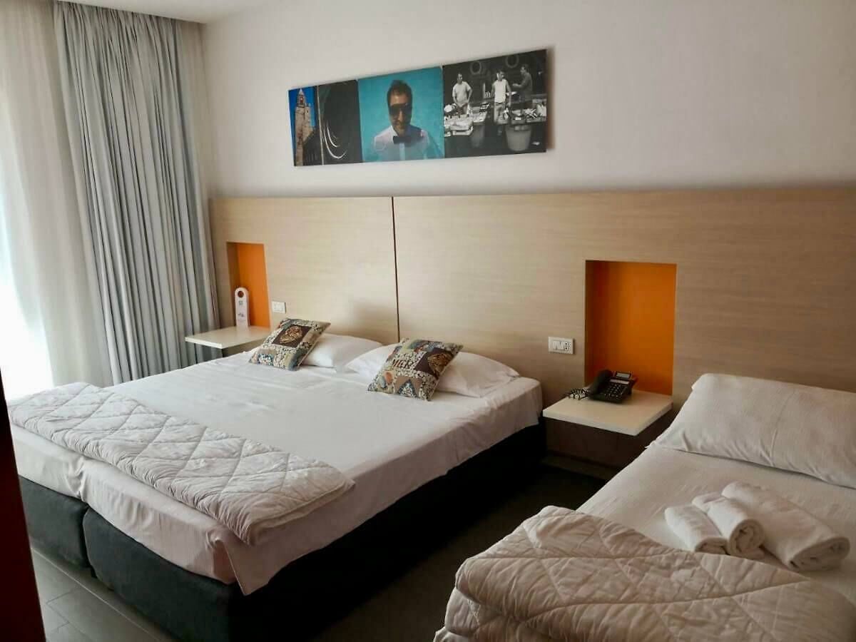 Triple Room, Pool View | In-room safe, desk, blackout drapes, free WiFi
