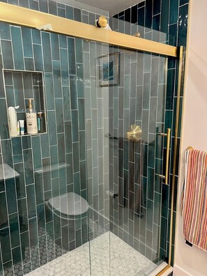 Shower, hair dryer, towels, soap