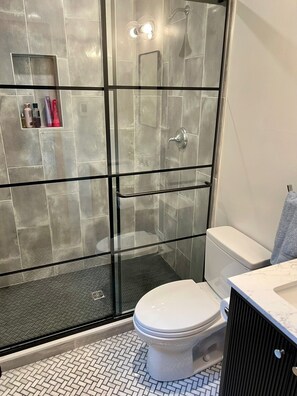 Shower, hair dryer, towels, soap