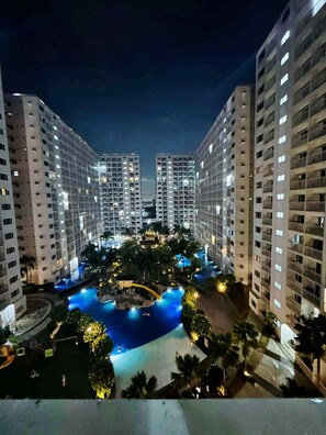 Deluxe Condo, Balcony, Pool View | Exterior - Shore Residences MOA staycation (Pasay)