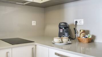 Fridge, microwave, stovetop, coffee/tea maker