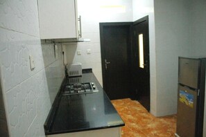 Comfort Apartment, Balcony, City View | Private kitchen | Fridge, microwave, oven, stovetop - Fancy Suites and Apartment (Abuja)