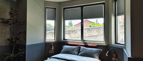 Deluxe Suite, Balcony, Pool View | Blackout drapes, soundproofing, iron/ironing board, free WiFi