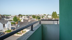 A residential area with houses and a clear sky.