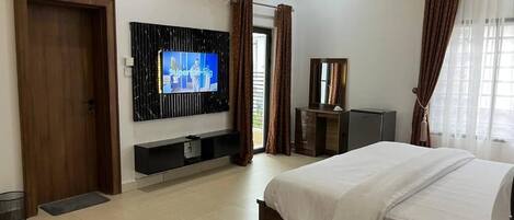 Economy Apartment, Balcony, City View | In-room safe, desk, laptop workspace, blackout drapes