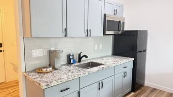 Microwave, coffee/tea maker, toaster, cookware/dishes/utensils