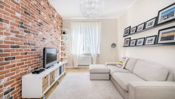 Apartamento conforto, vista para a cidade | Área de estar