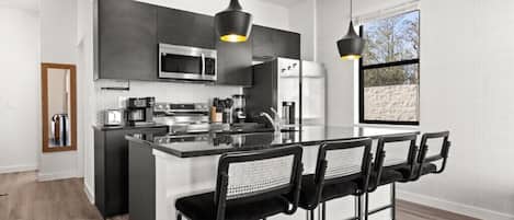Coffee/tea maker, fridge, microwave, oven
