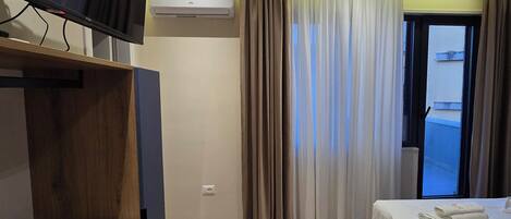 Deluxe Studio, Balcony, City View | Iron/ironing board, free WiFi