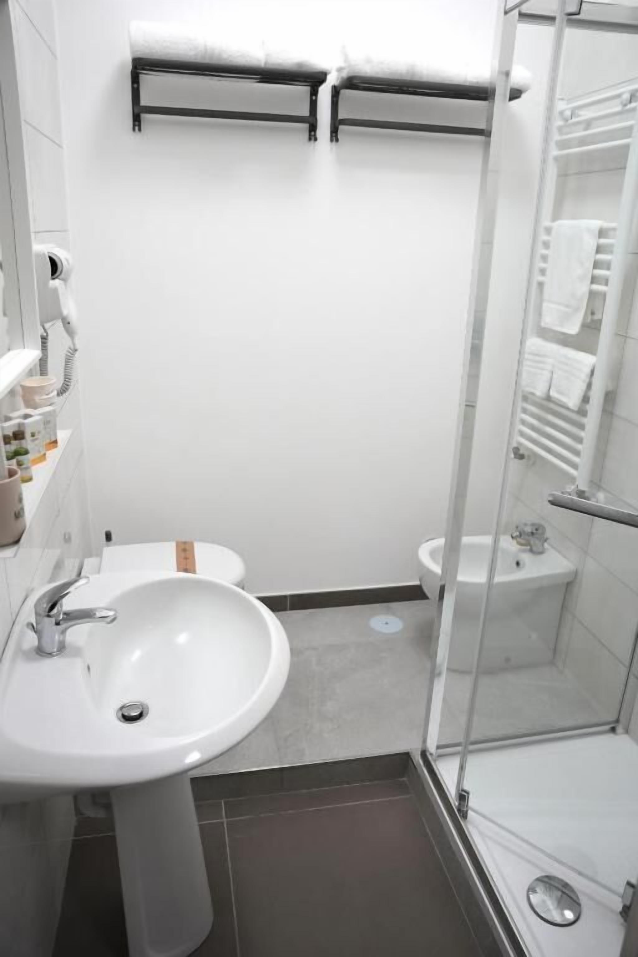 Shower, rainfall showerhead, hair dryer, towels