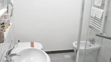 Shower, rainfall showerhead, hair dryer, towels