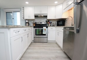 Microwave, oven, stovetop, dishwasher - Gulf and Lake Front Condo - Direct Beach Access (Panama City Beach)