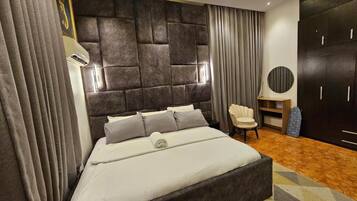 Family Apartment, Balcony, City View | In-room safe, desk, laptop workspace, blackout drapes