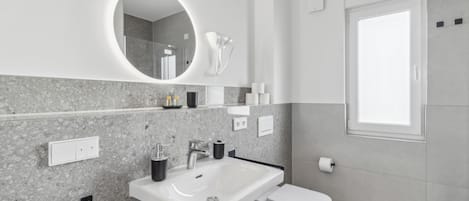 Hair dryer, towels, soap, toilet paper