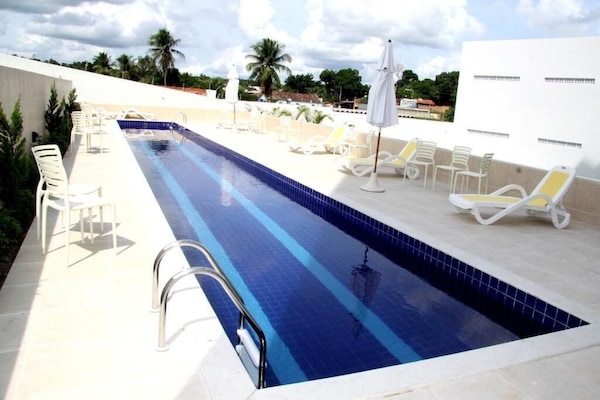 Outdoor pool, open 8:00 AM to 11:00 PM, sun loungers